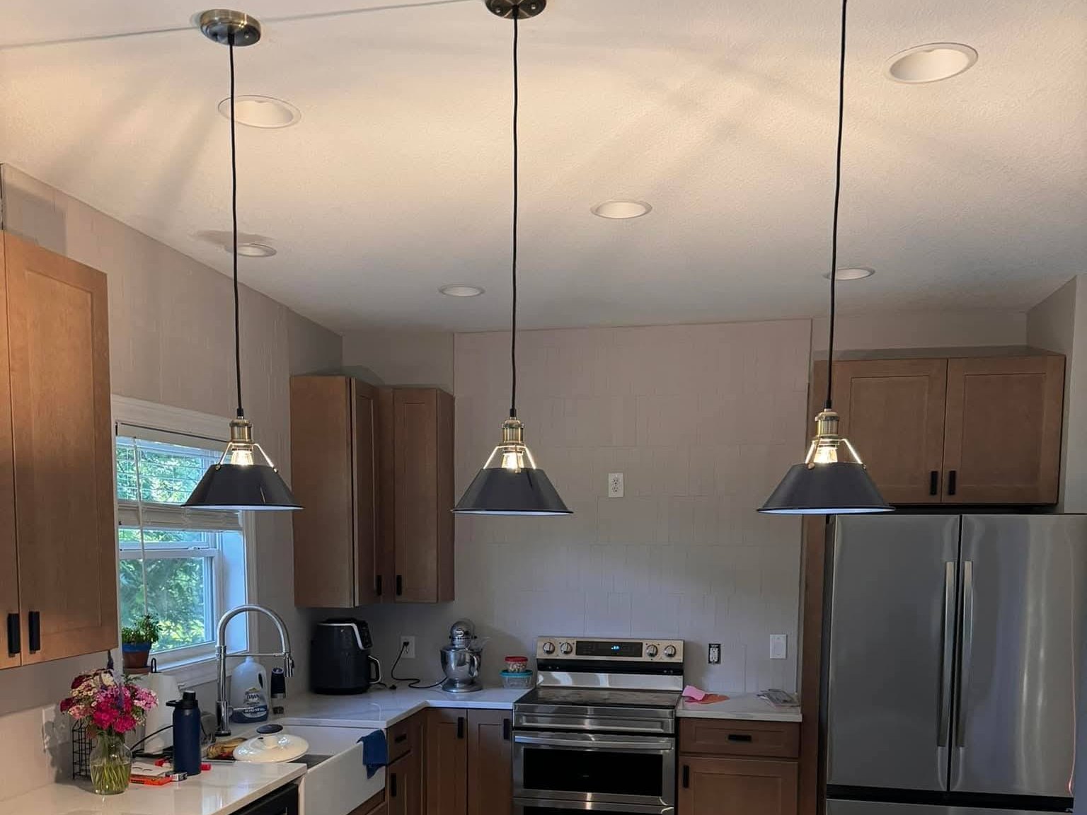 Beautiful kitchen remodel by The Jack of All Trades - white cabinets, quartz countertops, gold hardware